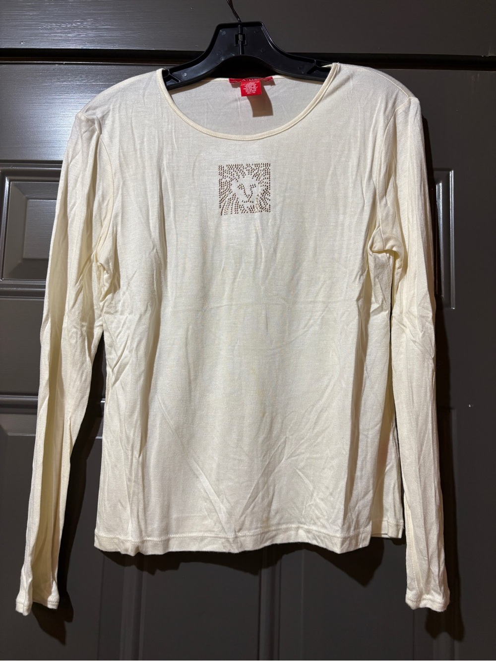 Anne Klein Long-Sleeve Cream Top with Gold Rhinestone Lion Logo